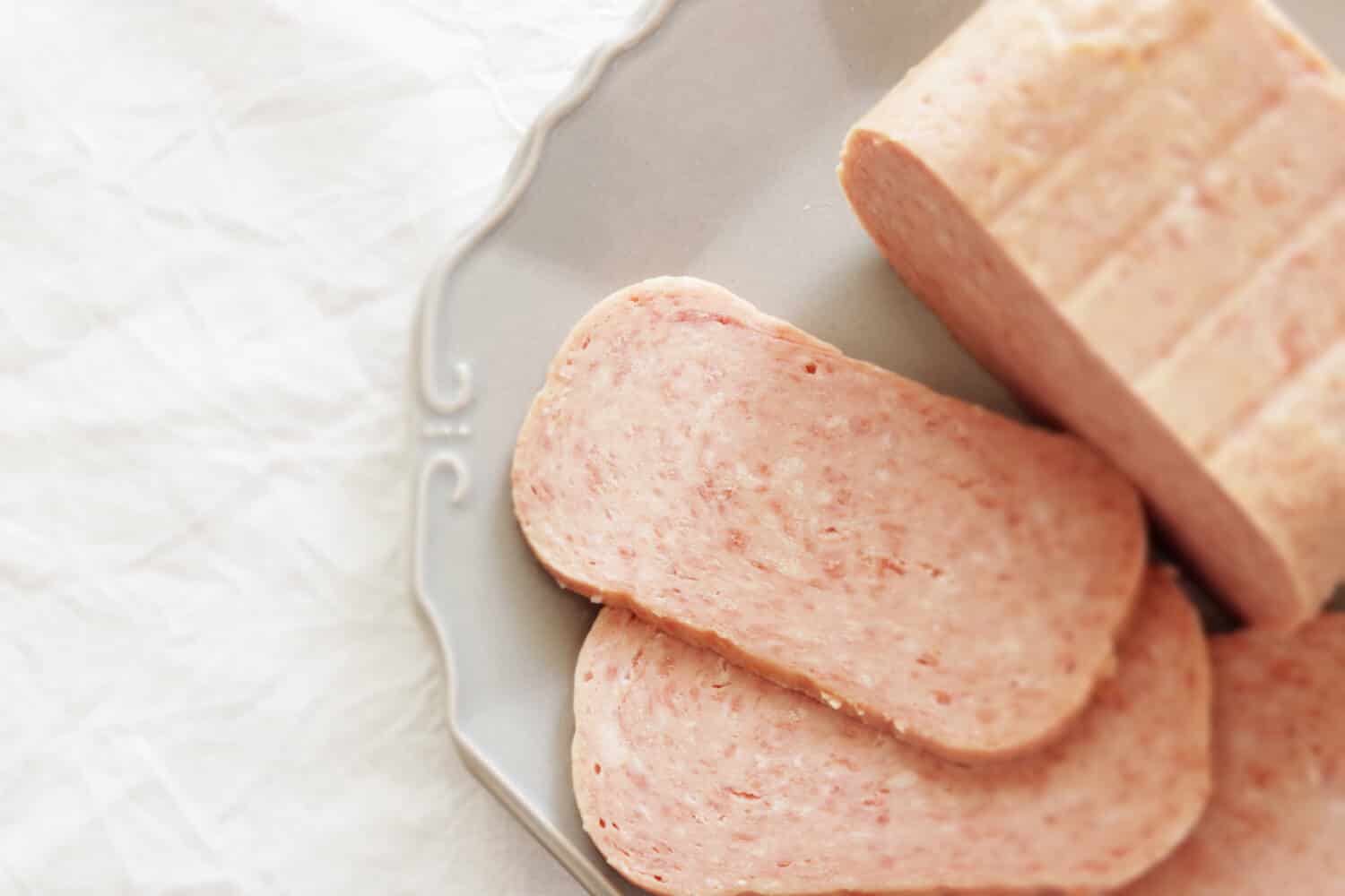 Canned food, sliced luncheon meat on dish