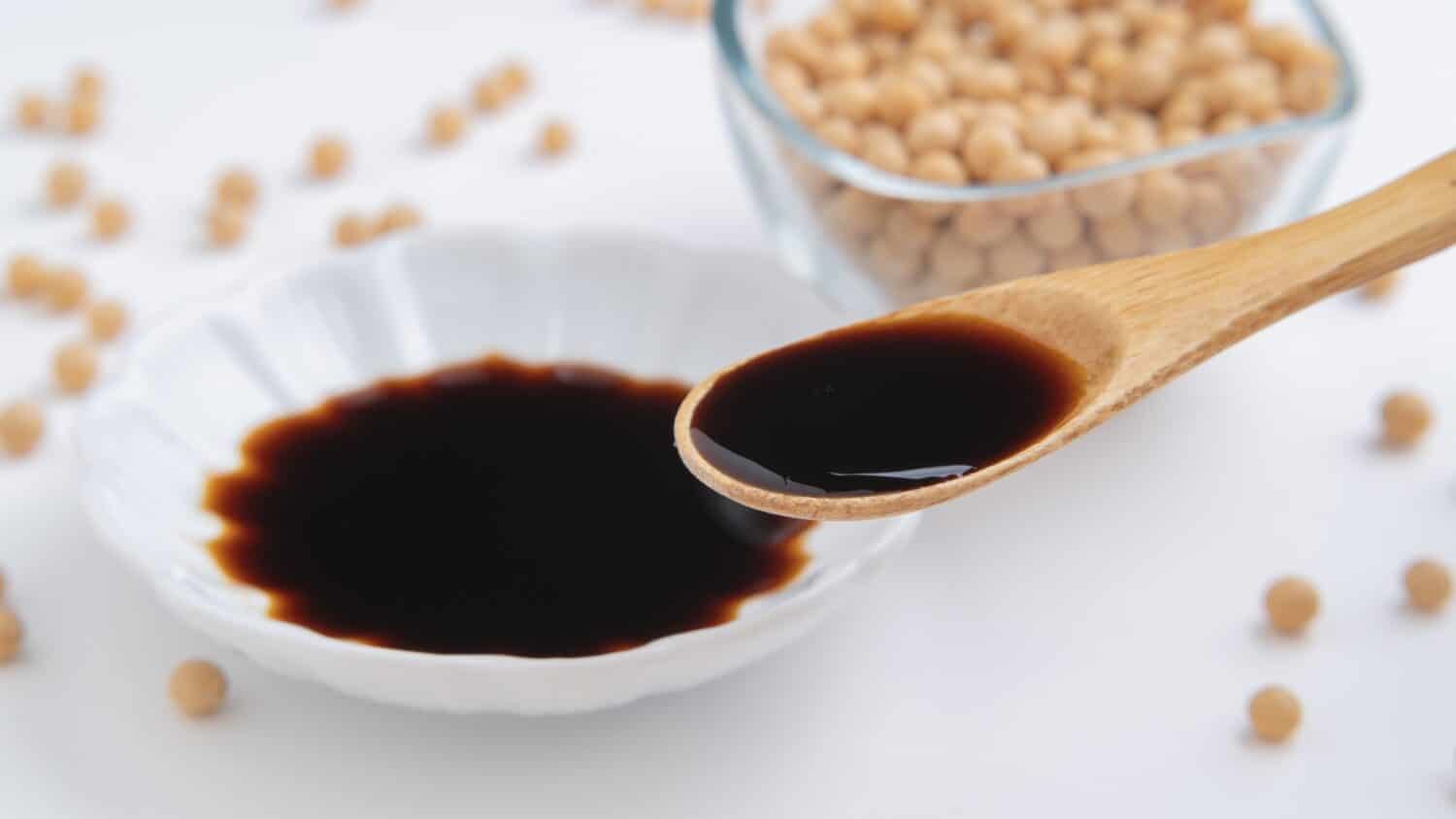 Japanese soy sauce and raw soybeans.