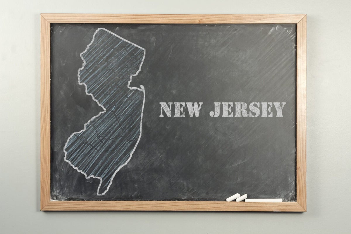 Outlined New Jersey US state on grade school chalkboard