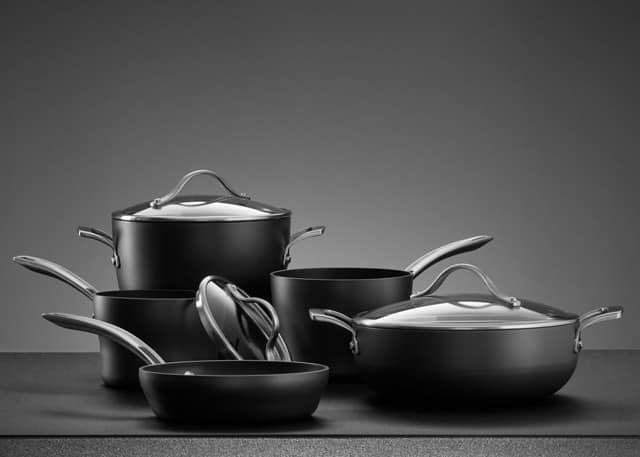 close up view of nice cookware set on grey color back
