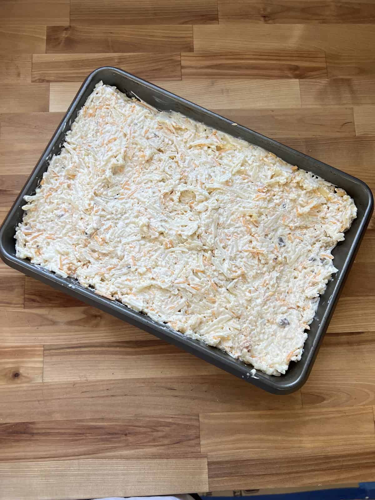 cheesy potatoes ready to go in the oven