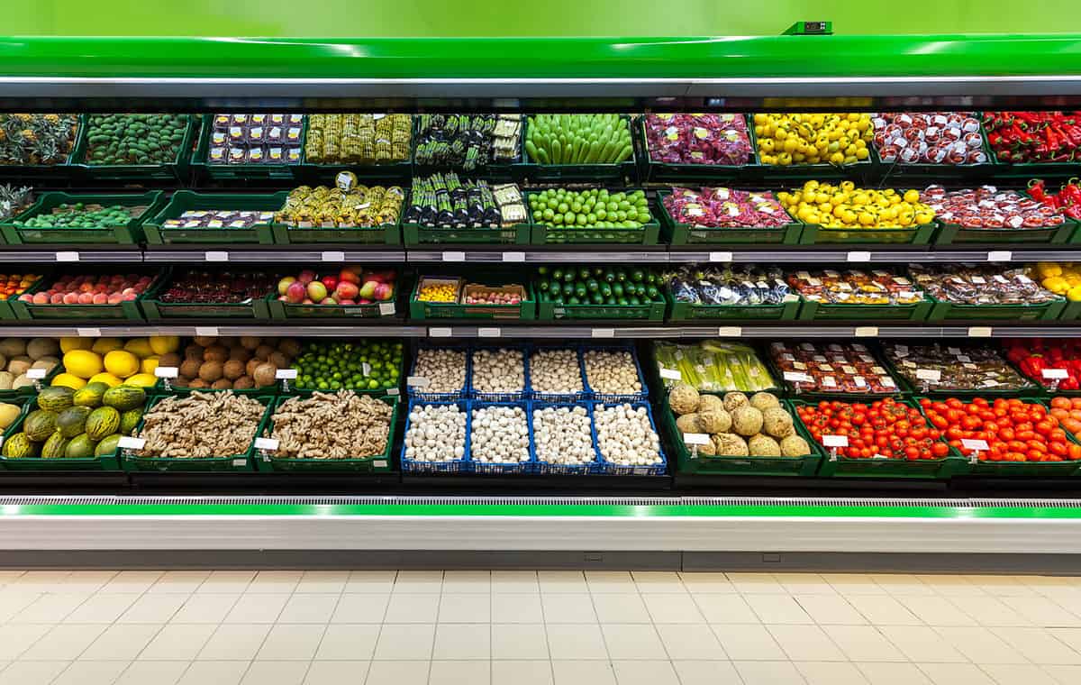 Fresh fruits and vegetables on the shelf in the supermarket