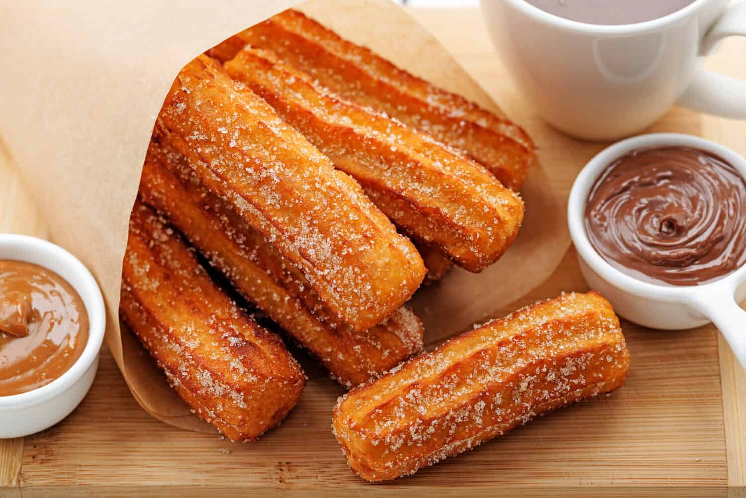 Churros with sugar and chocolate sauce