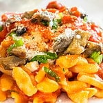 Gnocchetti alla Norma - traditional fresh pasta recipe with aubergines, tomato sauce, mozzarella cheese and salted ricotta