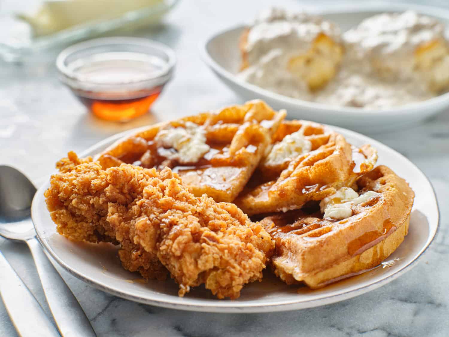 fried chicken and waffles breakfast with syrup