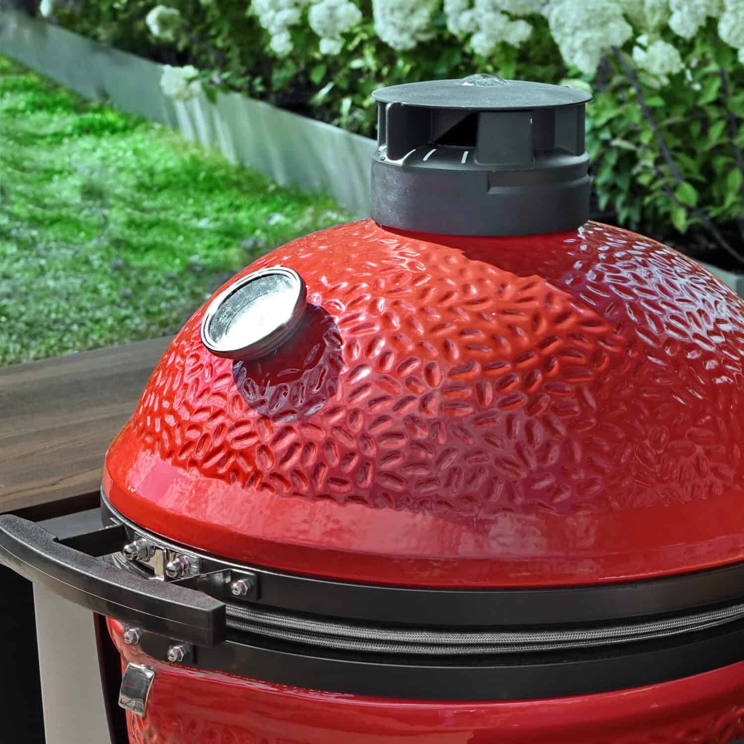 Big Ceramic Green Egg BBQ Grill. Kamado Barbecue Charcoal Grill For Cookout Food. Ceramic Barbeque Grill And Smoker On The Backyard Lawn Or Restaurant Outdoor Terrace.