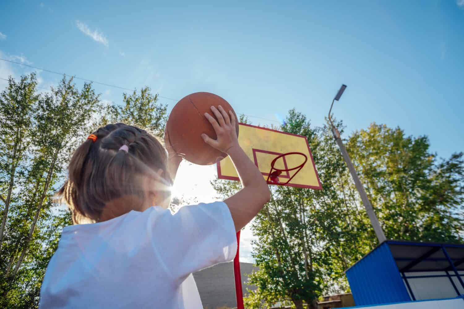 Golden Hour Glory: A Girl's Basketball Passion Shines Bright in the Sunset