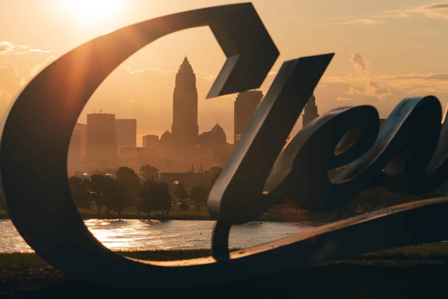 Cleveland skyline behind the Cleveland script sign at Sunrise