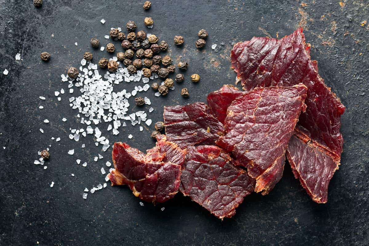 beef jerky and spice on old table