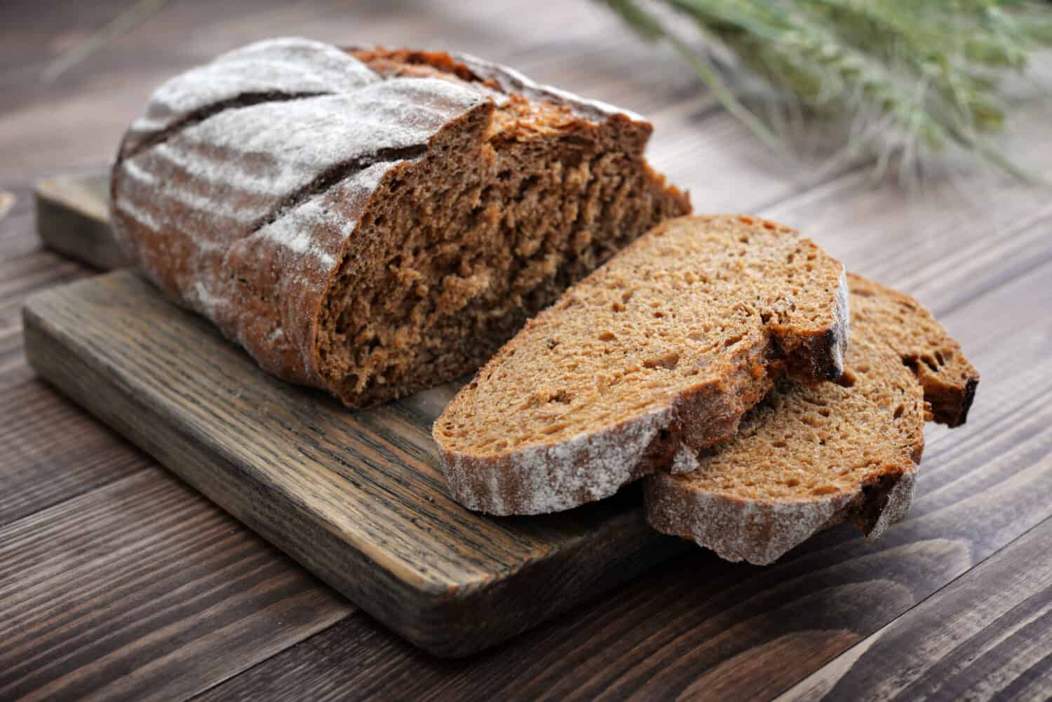 Sliced rye bread on cutting board closeup