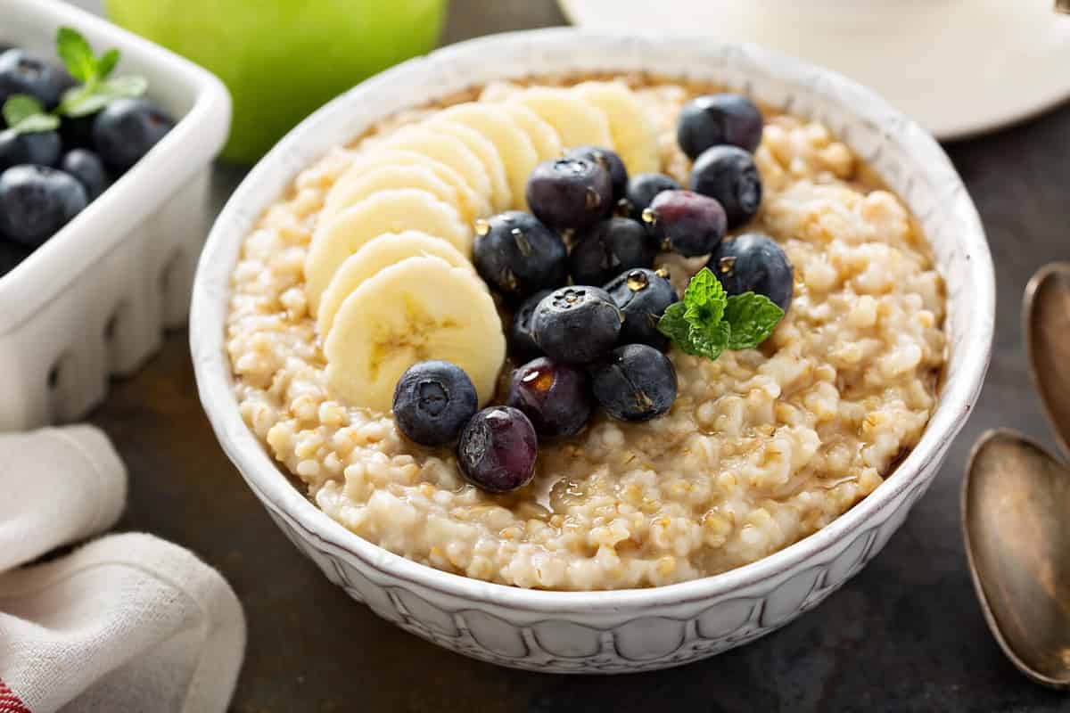 Steel cut oatmeal porridge with banana and blueberry for breakfast