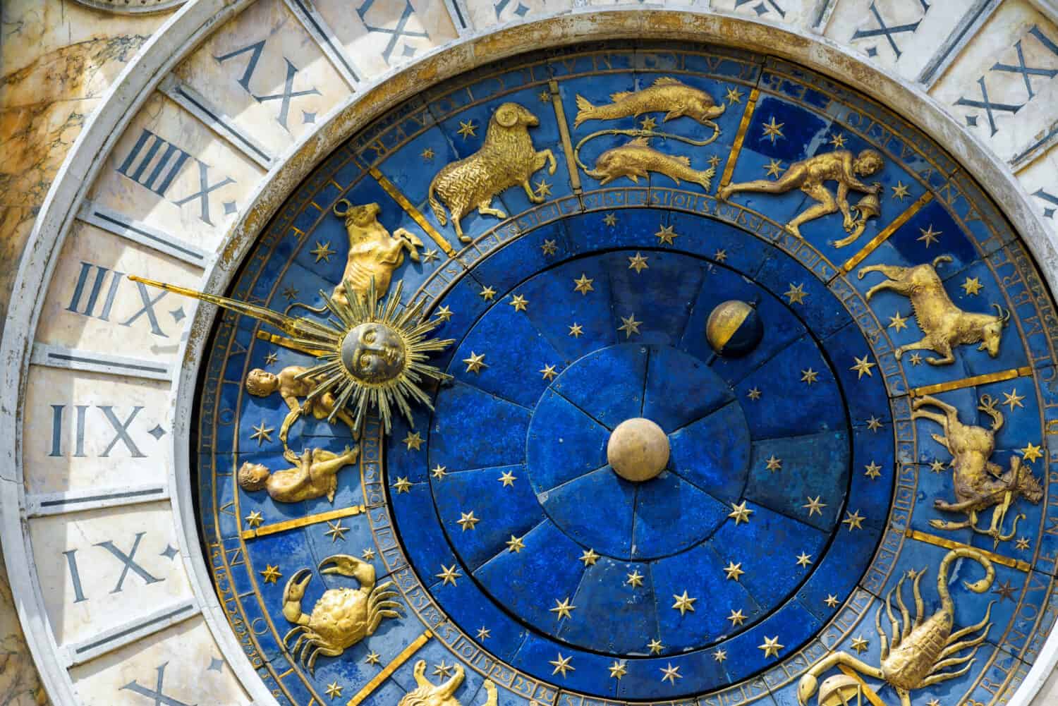 Zodiac signs on Ancient clock Torre dell'Orologio in Piazza San Marco, Venice, Italy, Europe. Detail of astrological vintage clock in old Venice city center close-up. It is nice historical landmark.