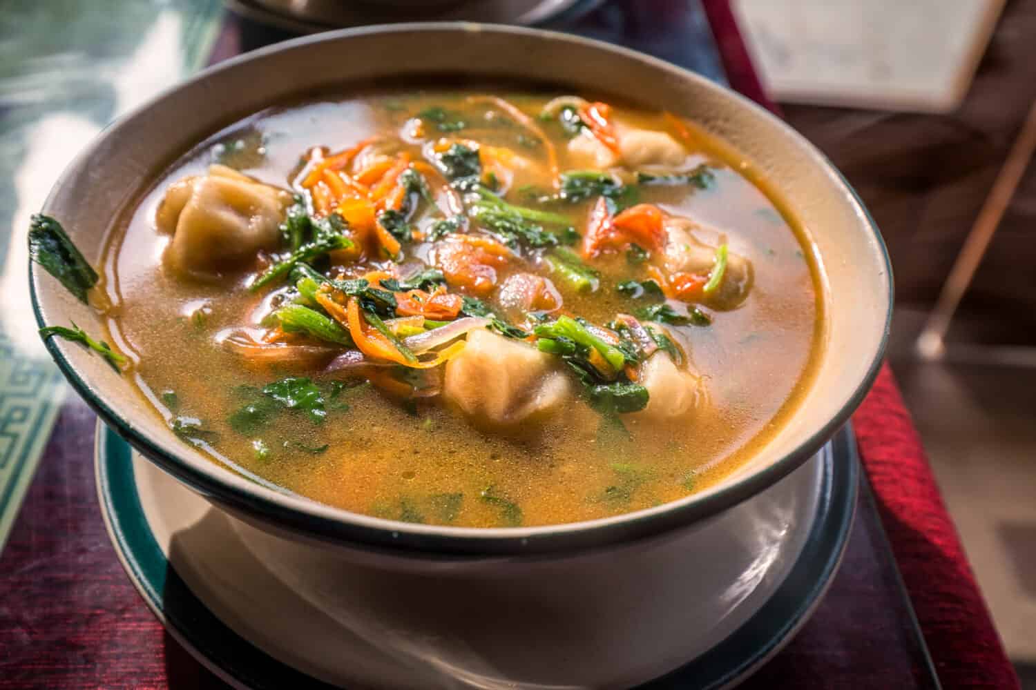 Traditional Tibetan food is momo soup with vegetables  Darjeeling, India.
