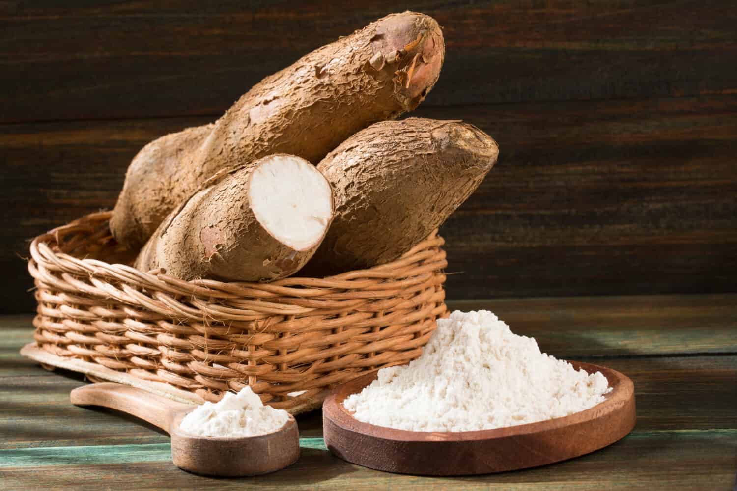 Raw cassava starch - Manihot esculenta. Wooden background