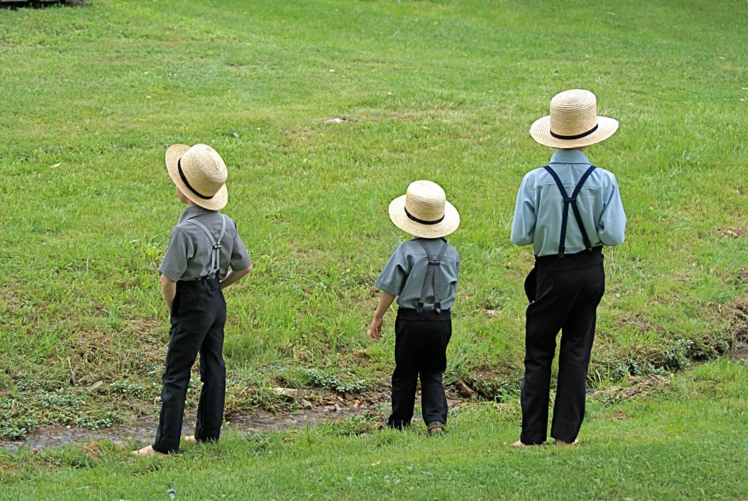 Amish Boys by a stream, Lancaster PA