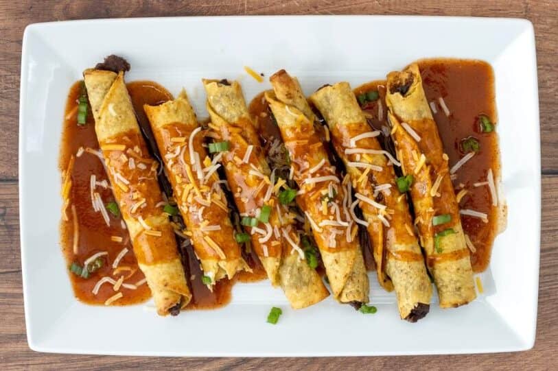 Bean and Cheese Taquitos on a Wooden Table