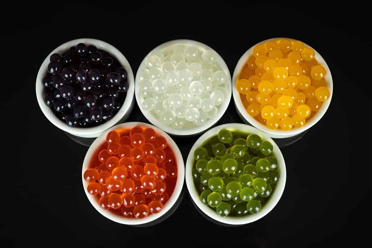 Different tapioca pearls for bubble tea. Bubble tea ingredients arrangement in bowls