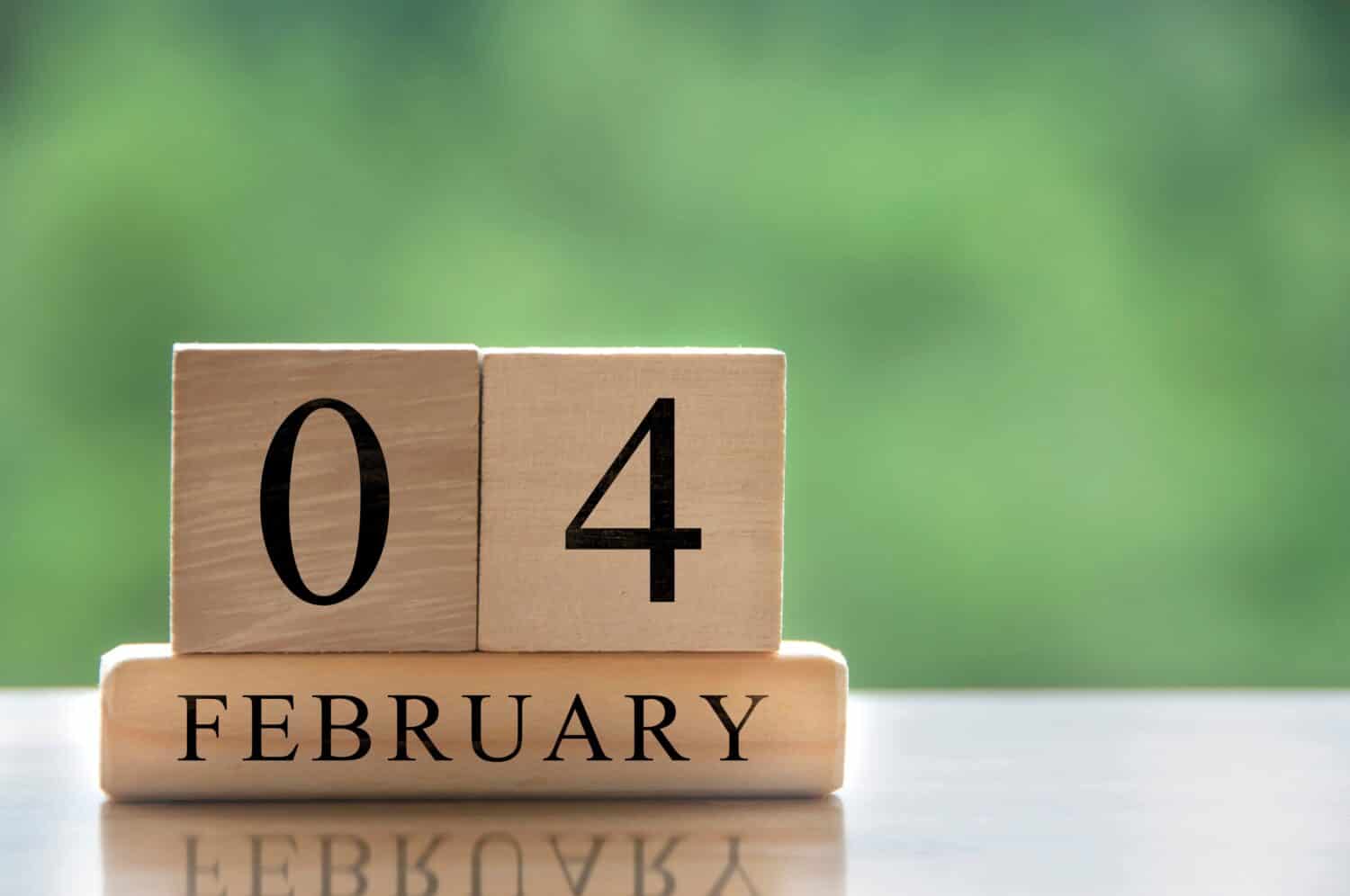 February 4 calendar date text on wooden blocks with customizable space for text or ideas. Copy space and calendar concept