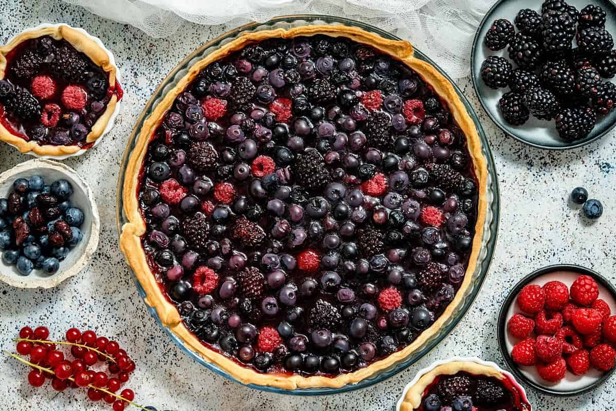 Sweet delicious homemade forest berry tart. Pie with blueberries and raspberries.