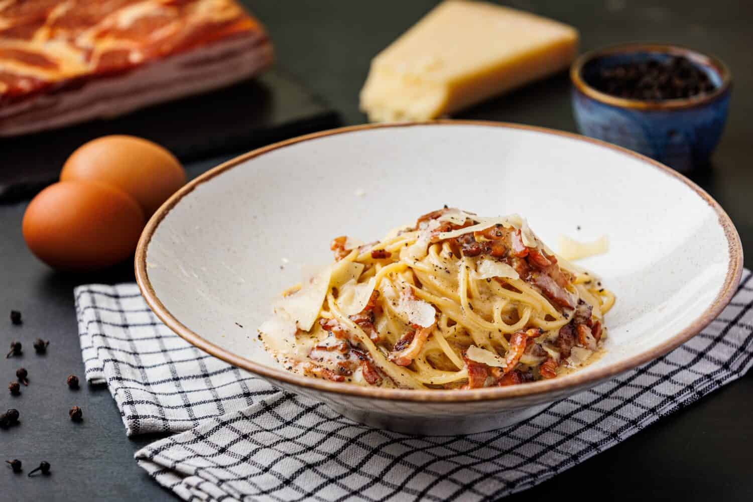 Pasta Carbonara - Italian pasta dish, traditionally done with only 4 ingredients - parmesan cheese, guanciale or pancetta, eggs and black pepper.