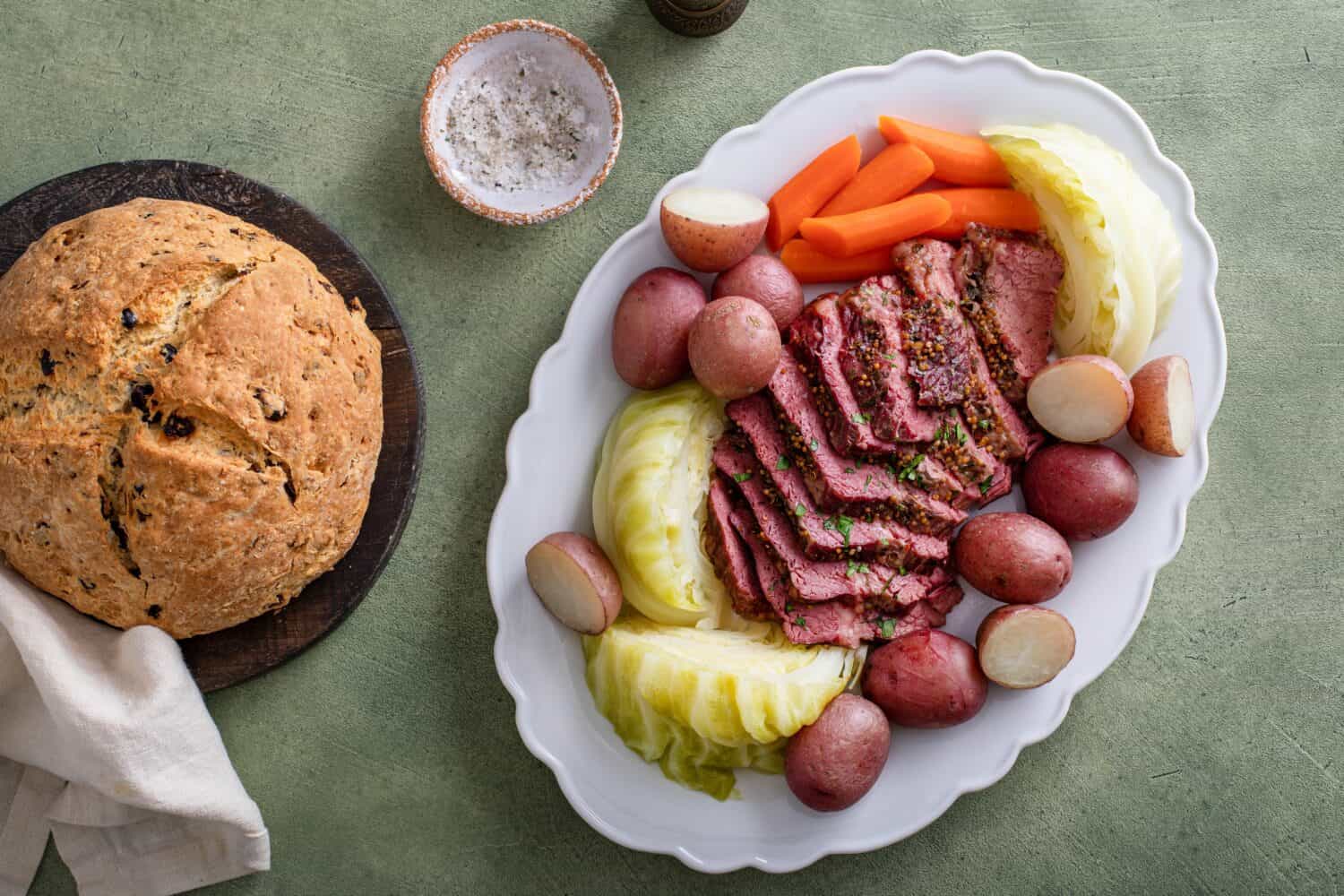 Corned beef with cabbage and potatoes on a serving platter, irish recipe idea for St Patricks day