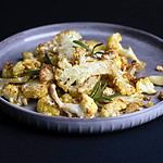 baked cauliflower on a black background. french cuisine