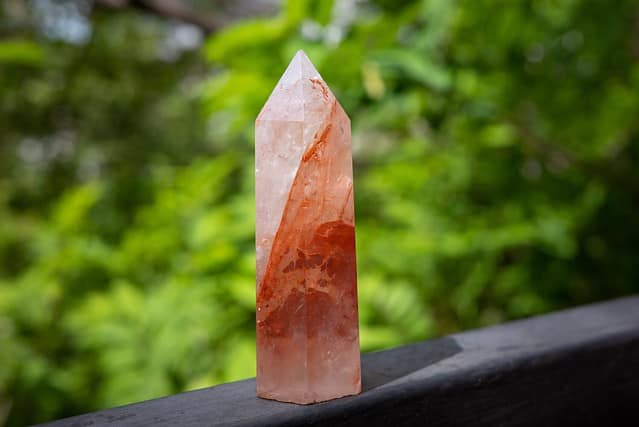 A tower of red hematoid quartz healing crystal