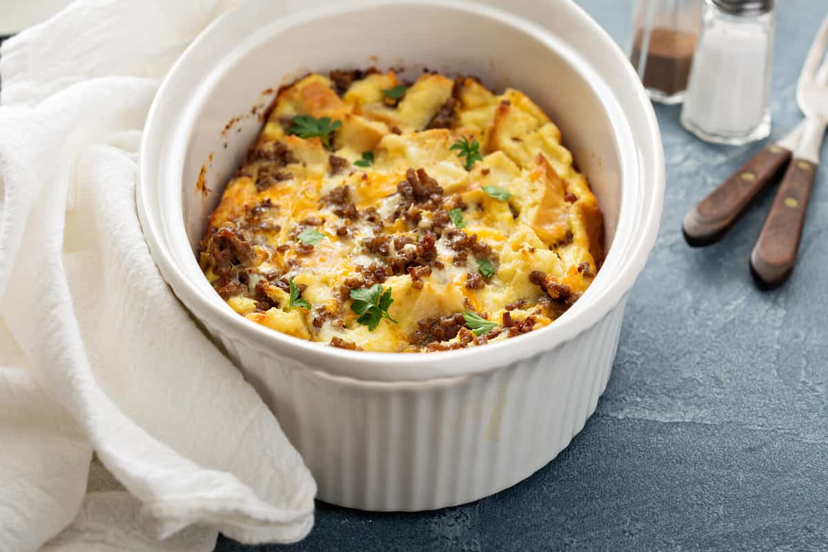 Breakfast strata with cheese and sausage in baking dish