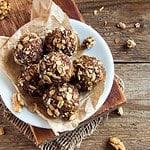 Healthy organic energy granola bites with nuts, cacao, banana and honey - vegan vegetarian raw snack or meal