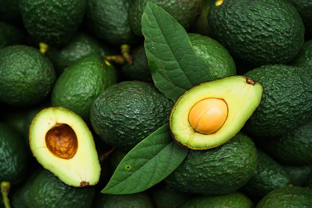 Fresh organic hass avocados, top view with copy space