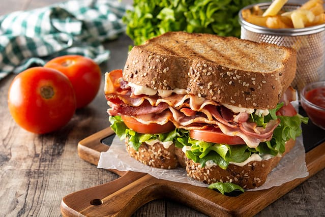 BLT sandwich with bacon,lettuce and tomato on wooden table