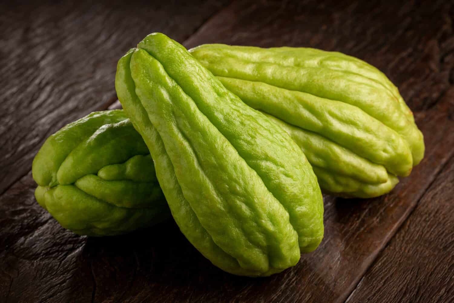 Fresh chayote fruits on the table.