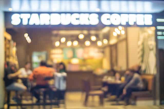 People in Coffee shop blur background with bokeh lights, vintage filter, blurred of star buck cafeteria coffee