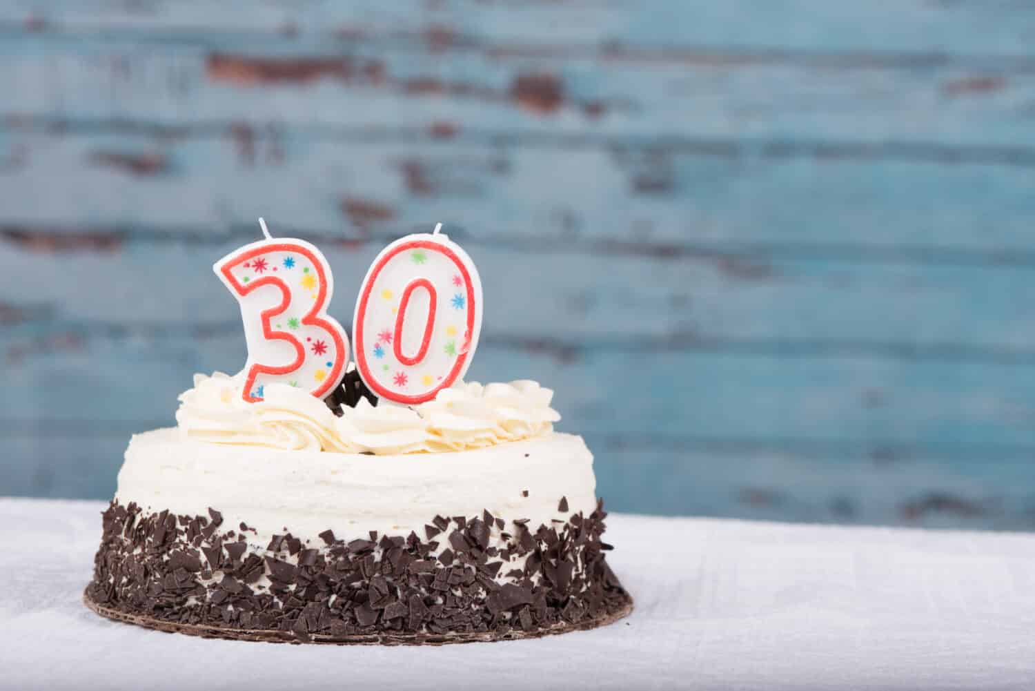 White and chocolate cake with 30 candles