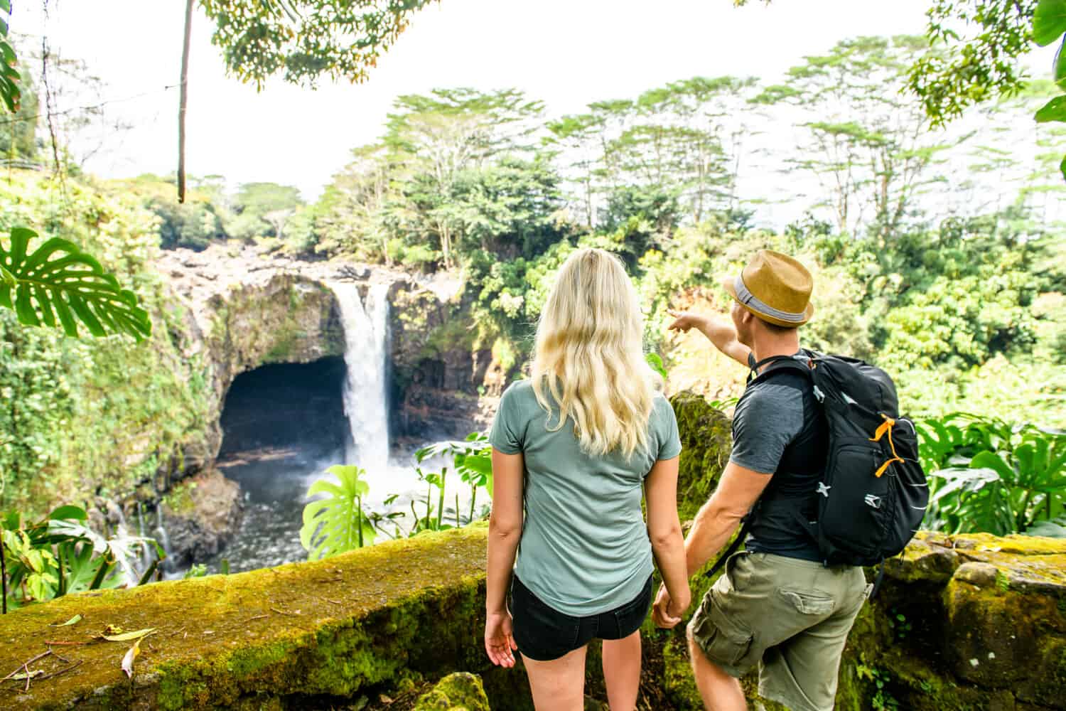 A couple at The Rainbow Falls, Hilo, Wailuku River State Park, Big Island, Hawaii