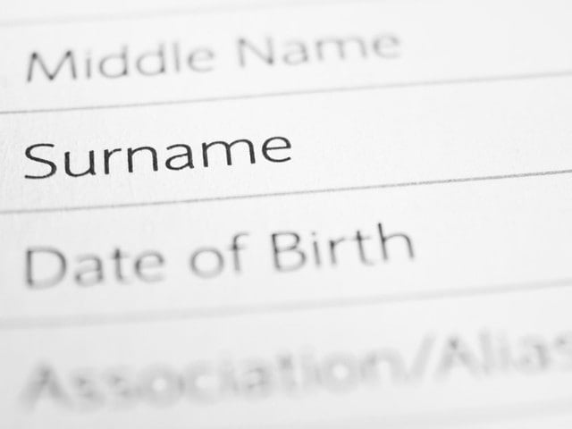 SURNAME close up on a printed form