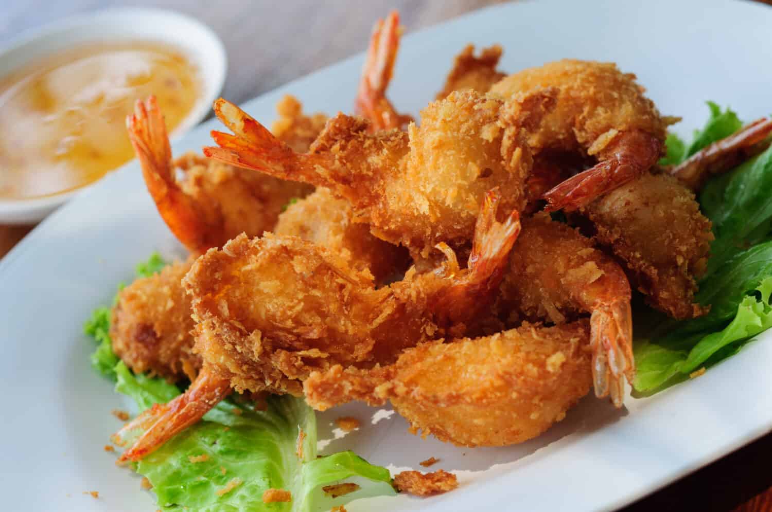 fried shrimp meat ball with sweet sauce on wooden table