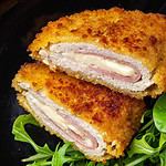 cordon bleu cutlet chicken meat, cheese, bacon meal snack on the table copy space food background rustic top view