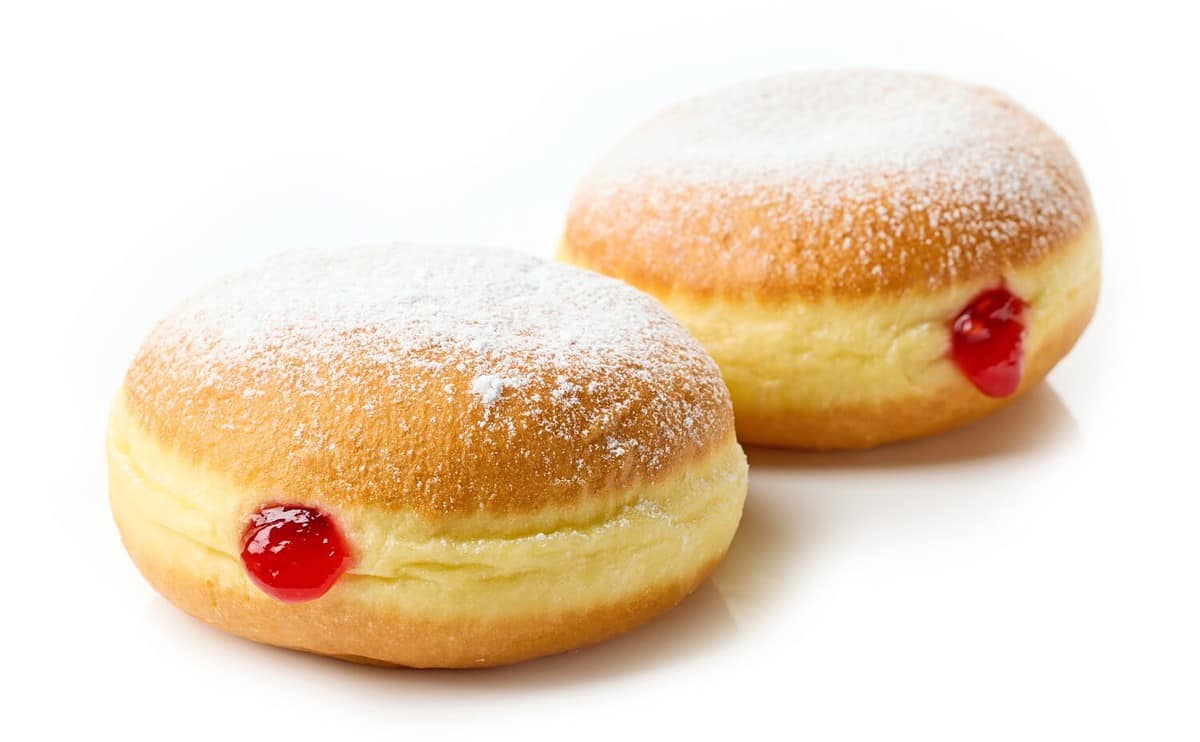 freshly baked jelly donuts isolated on white background