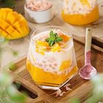 Creamy homemade mango sago pudding, made from mango puree, sago pearls, pomelo, and coconut milk with slices of mango on top. Mango sago is a sweet and savory dessert that originates from Hong Kong.
