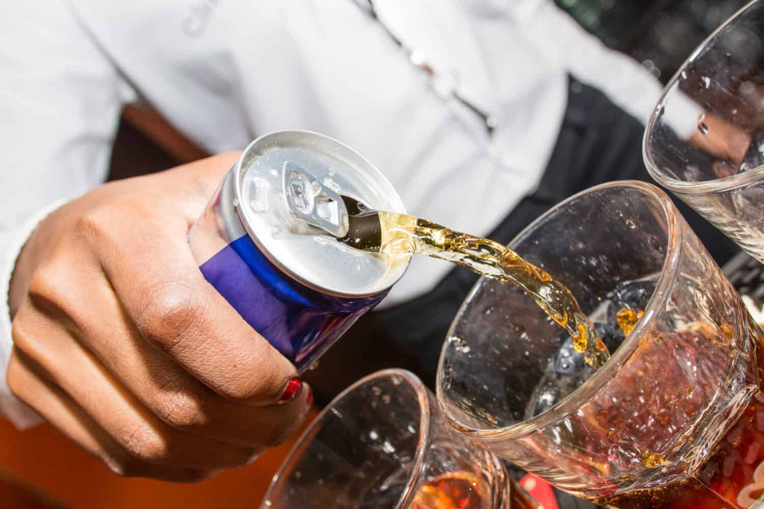 Energy drink being poured by bartender 