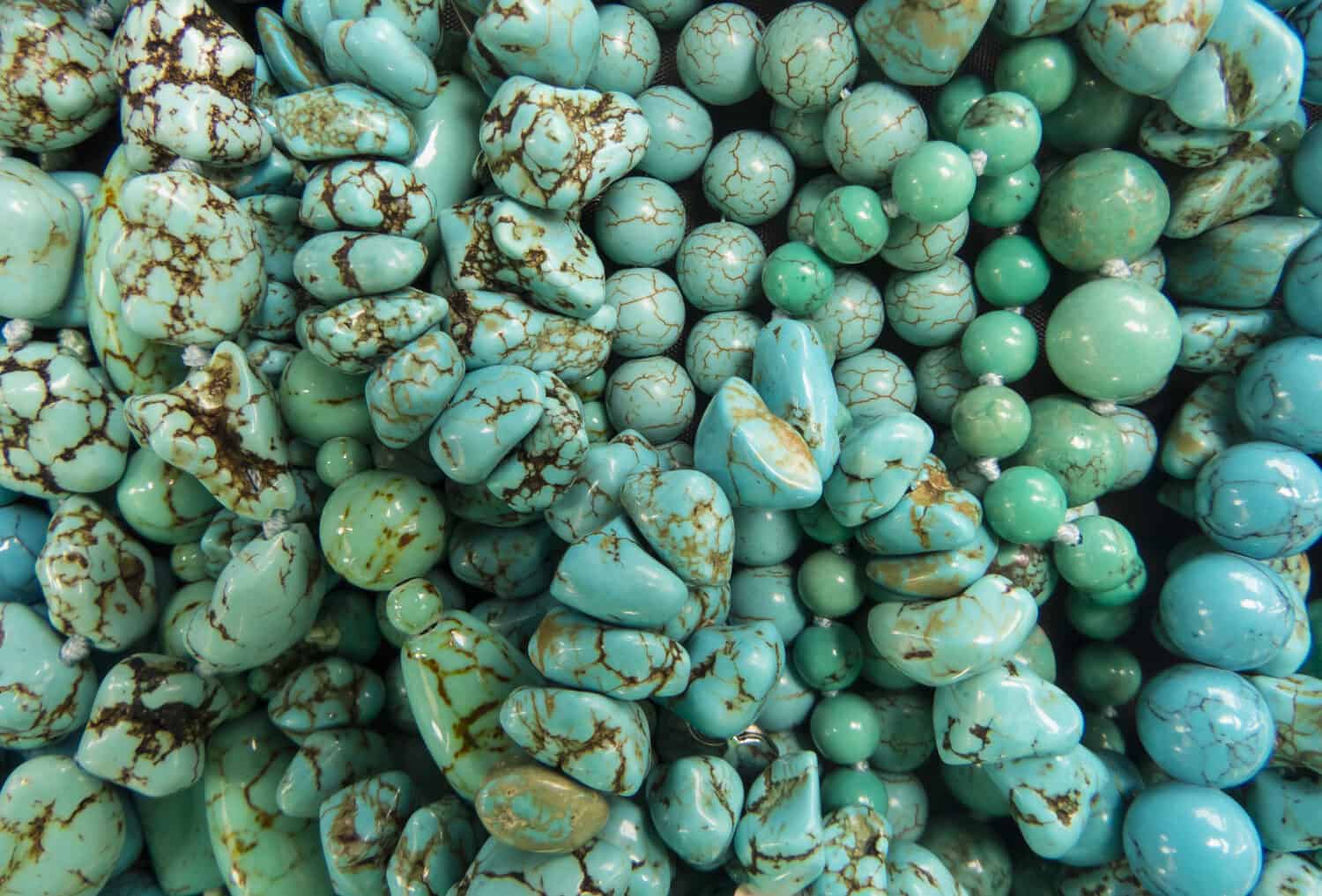 Turquoise stones as background . turquoise jewelry,beads.