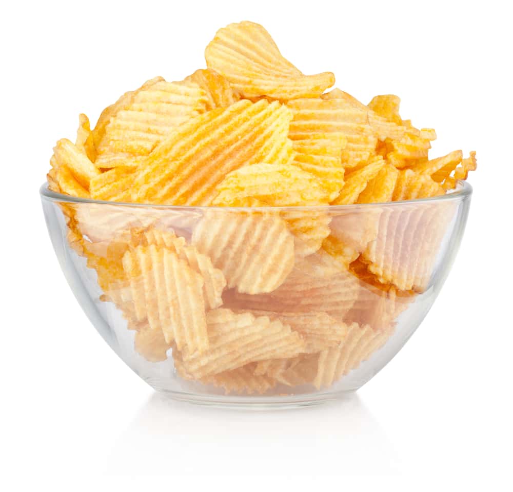 Crinkle cut potato chips in bowl isolated on a white background