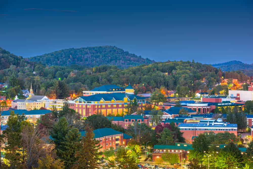 Boone, North Carolina, USA campus and town skyline at twilight.