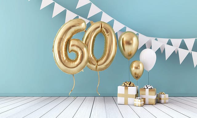 Happy 60th birthday party celebration balloon, bunting and gift box. 3D Render