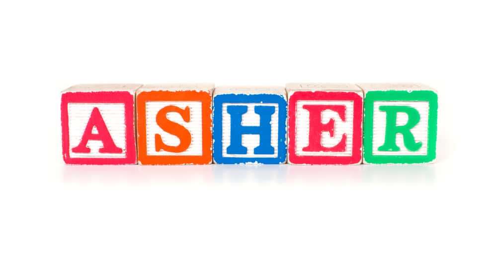 Toy blocks spelling out the name "ASHER"