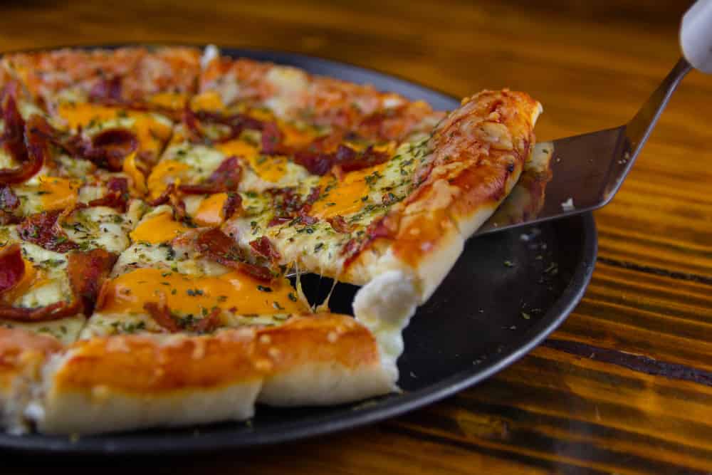 Pizza with stuffed edge and bacon, cheddar cheese