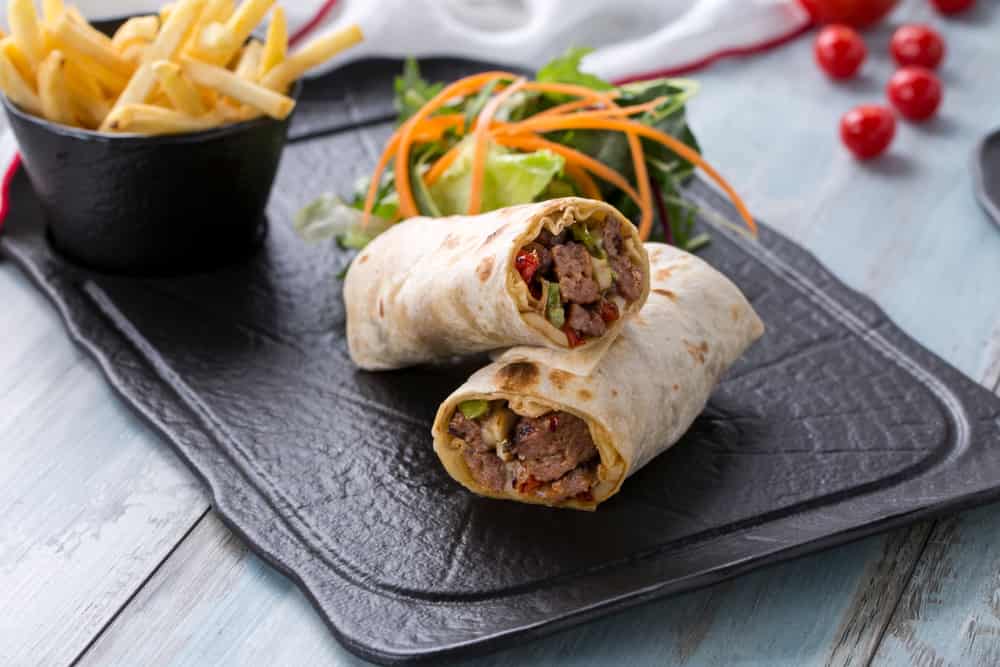 beef wrap , beef burrito beef roll, lamb wrap , lamb burrito lamb roll on the wooden background