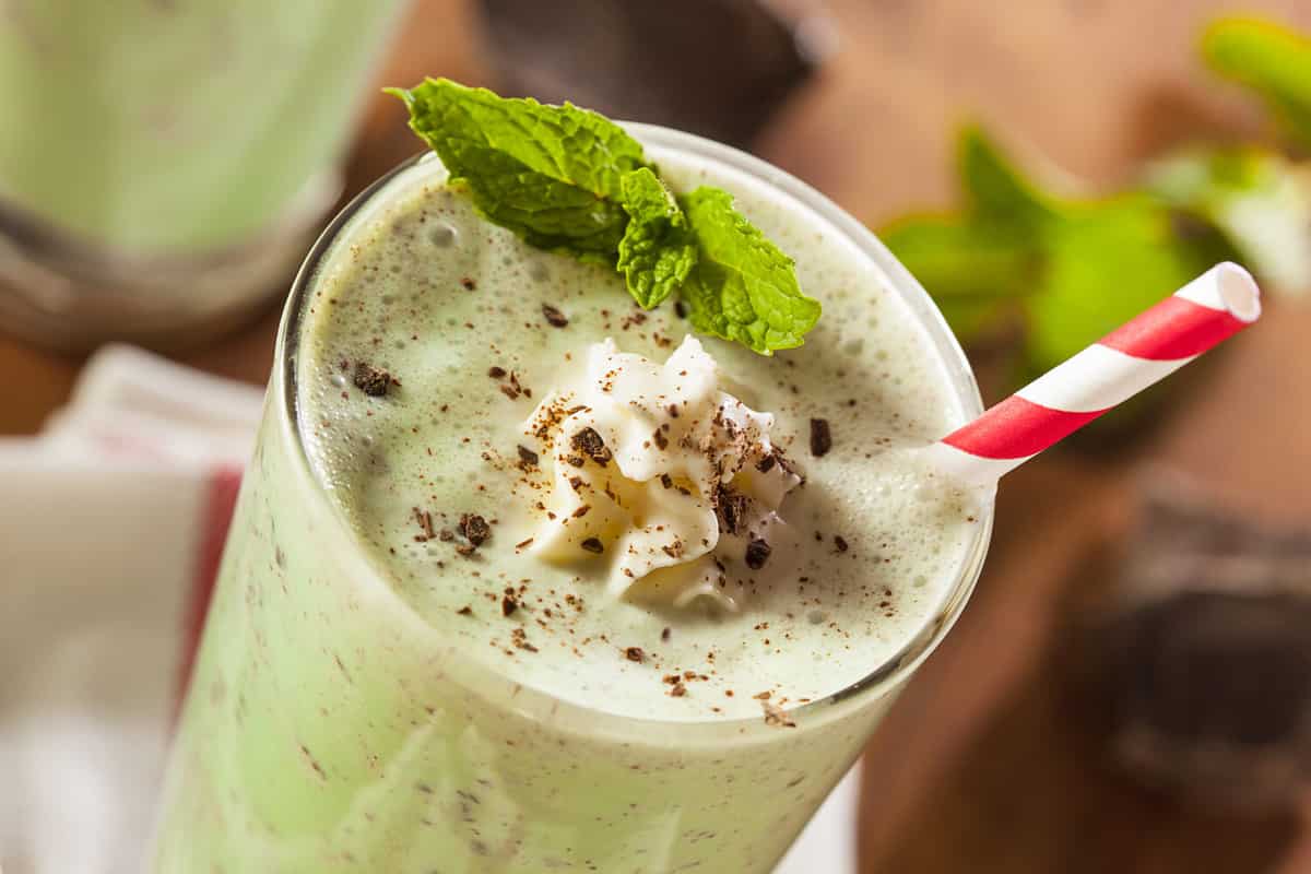 Cold Refreshing Mint Chocolate Chip MilkShake with a Straw