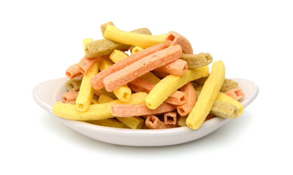 Naturally Baked Veggie Straws Made From Tomatoes, Spinach and Potatoes on white background